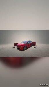 Rotes Fahrzeug bei einer digitalen Enthüllung mit Geschenkbox